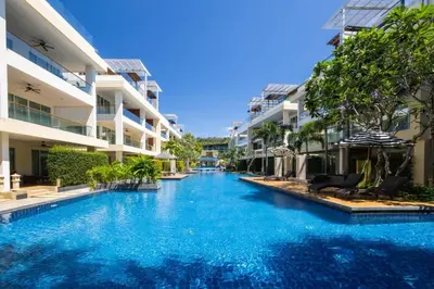 a swimming pool in front of some apartment buildings at VIP Suite Residence At Tubkaak Beach, Krabi in Ban Ko Kwang