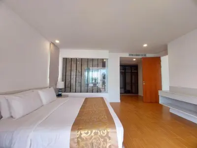 a bedroom with a large bed and a window at VIP Suite Residence At Tubkaak Beach, Krabi in Ban Ko Kwang
