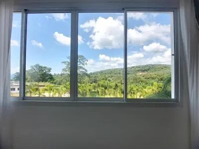 a window with a view of a mountain at VIP Suite Residence At Tubkaak Beach, Krabi in Ban Ko Kwang