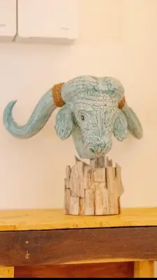 a statue of an elephant with long tusks at The beach house in Surin Beach