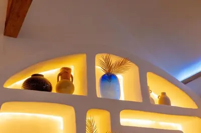 a shelf with vases and vases on it at The beach house in Surin Beach