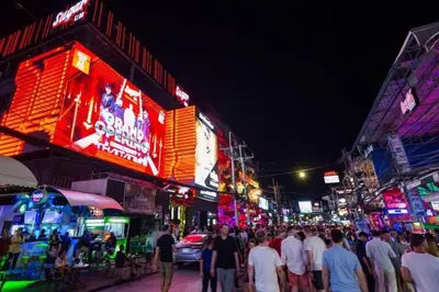 a crowd of people walking down a city street at night at Tropical Seaview Studio A601 at VV Patong, Just 5 Min Drive from Patong Nightlife in Patong Beach
