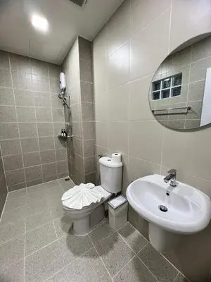 a bathroom with a toilet and a sink and a mirror at Kata walk&wave hostel in Kata Beach