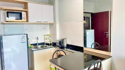 a kitchen with a refrigerator and a sink at spacious and modern Apartment in Ao Nang in Ban Khlong Haeng