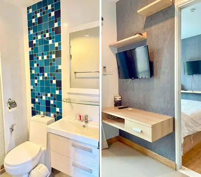 a bathroom with a sink and a toilet and a tv at spacious and modern Apartment in Ao Nang in Ban Khlong Haeng