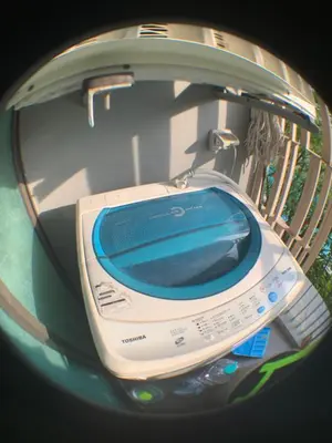 a close up of a cell phone in a car mirror at Cozy condo in Ban Tha Khreng