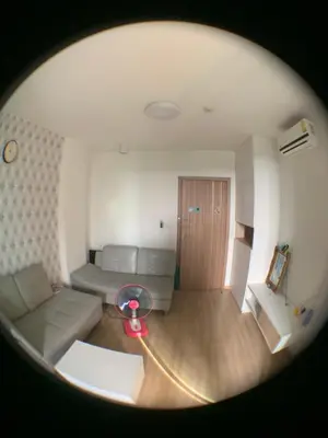 a living room with a couch and a table at Cozy condo in Ban Tha Khreng