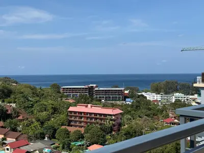 a view of a city with buildings and the ocean at Luxury Seaview studio apartment at Karon beach in Karon Beach