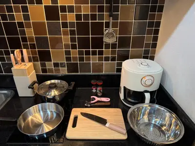 a kitchen counter with a cutting board and a mixer at Luxury Seaview studio apartment at Karon beach in Karon Beach