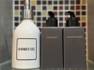 two bottles of shower gel sitting next to each other at Luxury Seaview studio apartment at Karon beach in Karon Beach