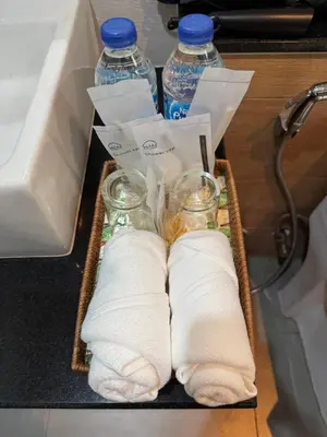 a box with two bottles of water and towels at Luxury Seaview studio apartment at Karon beach in Karon Beach