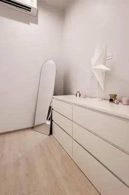 a white kitchen with a mirror and a dresser at SPACIOUS AND BRIGHT 2BR TownHouse7 MonkeyHill in Ban Sam Kong