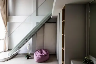 a room with a staircase and a purple bean bag at SPACIOUS AND BRIGHT 2BR TownHouse7 MonkeyHill in Ban Sam Kong