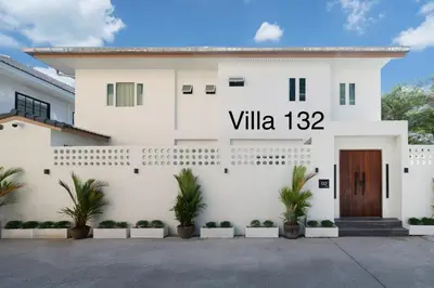 a white house with a sign that reads villa at Patong private pool Villa 5BR 4Bath in Patong Beach