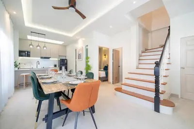 a dining room and kitchen with a table and chairs at Patong private pool Villa 5BR 4Bath in Patong Beach