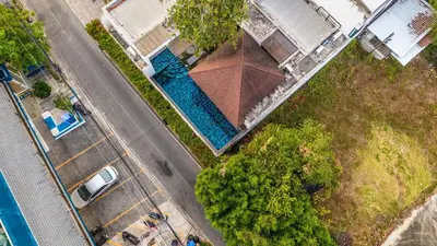 an overhead view of a pool of water next to a road at V172 Siena Villa Stunning 3-Bedroom & Private Pool in Kata Beach