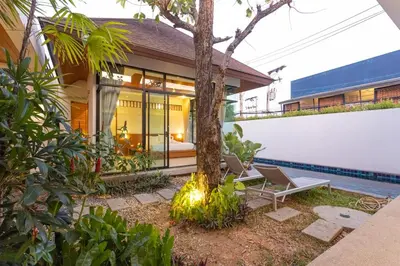 an image of a house with a tree in the yard at V172 Siena Villa Stunning 3-Bedroom & Private Pool in Kata Beach