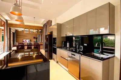 a kitchen with a sink and a counter top at 29 - Modern Pool Villa between Naiharn & Rawai in Ban Saiyuan (1)