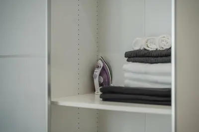a shelf in a bathroom with a stack of towels at Квартира в The Title Halo 1 in Nai Yang Beach