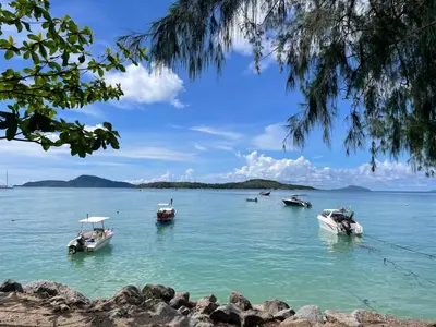 a group of boats floating in the water at Two bedrooms Penthouse Seaview Rawai Beach Phuket in Phuket Town