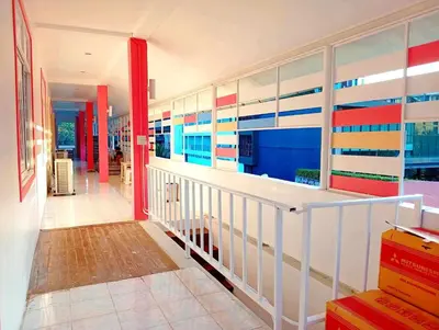 a hallway of a house with colorful walls at Go To Party Hostel and Bar Aonang in Ao Nang Beach