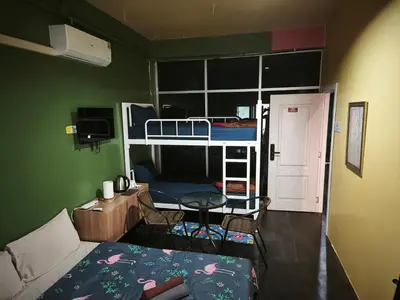 a small room with a bed and a bunk bed at Bonanza Patong Beach2 100m to Beach Green Room in Patong Beach