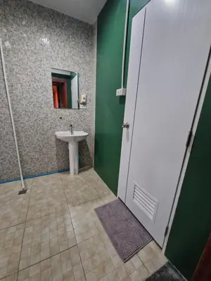 a bathroom with a sink and a mirror at Bonanza Patong Beach2 100m to Beach Green Room in Patong Beach