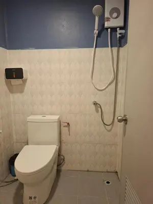 a bathroom with a toilet and a shower at Fadel Residence in Ko Yao Yai