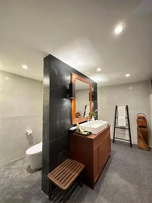 a bathroom with a sink and a toilet and a mirror at 33 - The Cove in Laem Singh Beach in Surin Beach