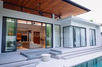 a villa with a swimming pool and a house at Villa M18 in Ban Pak Lak