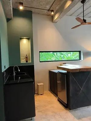 a kitchen with a sink and a window at Sky Lofts Airport Phuket in Nai Yang Beach