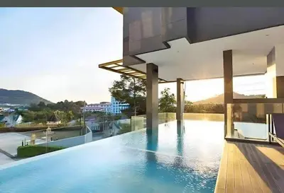 a swimming pool on the roof of a house at Utopia Kathu Condo in Phuket Town