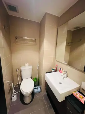 a bathroom with a toilet and a sink at Utopia Kathu Condo in Phuket Town