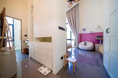 a bedroom with a bed and a desk and a chair at Luxury KING 3 BR, Gym, Sauna, BBQ, AirCon, 8 min Beach, Tennis Court, Boating Ave in Ban Pak Lak