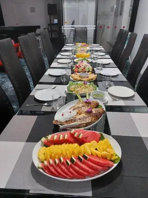 a long table with plates of food on it at Chalong - 10 BR Private Pool Villa - Villa Nap Dau - Phuket in Chalong