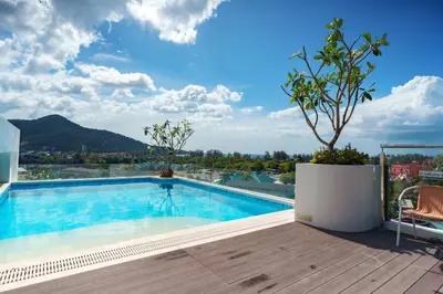 a swimming pool on the roof of a house at Super 1Bdr Fantasea, Kamala Beach Roof Pol Wi Fi in Kamala Beach