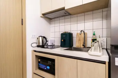 a kitchen with a sink and a microwave at Super 1Bdr Fantasea, Kamala Beach Roof Pol Wi Fi in Kamala Beach