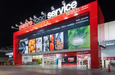 a store with a large sign on the side of it at Sea view studio Chic Condo Karon in Karon Beach