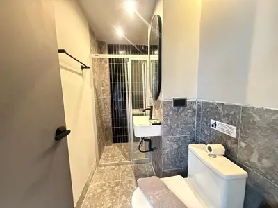a bathroom with a toilet and a sink at Leon's Loft House in Patong Beach
