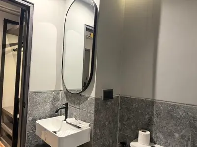 a bathroom with a sink and a mirror at Leon's Loft House in Patong Beach