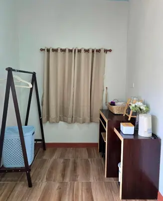 a room with a dresser and a shower curtain at Aonang Riverside Home in Ban Khlong Son