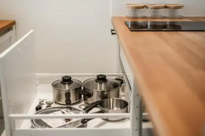 two pots and pans on a stove in a kitchen at Квартира в The Title Halo 1 in Nai Yang Beach