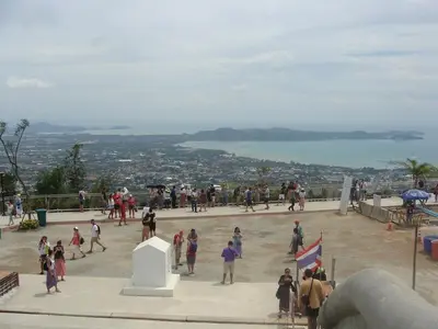 a group of people standing on top of a building at CHEZ MAURICE A RAWAIi in Rawai Beach