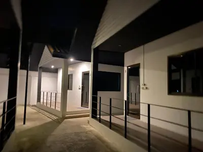 an empty hallway of a building at night at Гостевой домик in Ban Saiyuan (1)