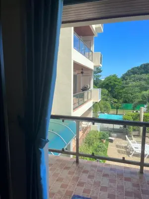 a view from the balcony of a building with a pool at Family place in Ban Saiyuan (1)