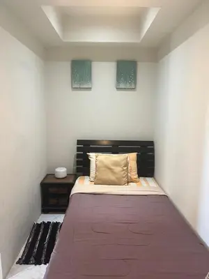 a bedroom with a large bed in a room at Family place in Ban Saiyuan (1)