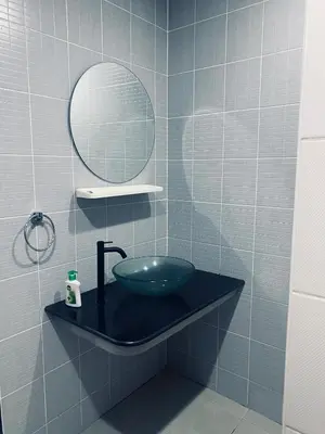 a bathroom with a bowl sink and a mirror at Гостевой домик in Ban Saiyuan (1)