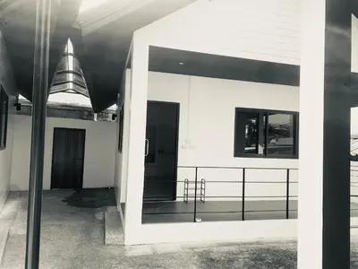 a black and white photo of a building at Гостевой домик in Ban Saiyuan (1)
