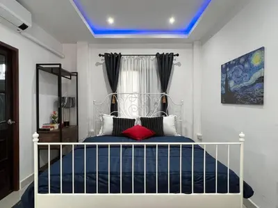 a bedroom with a bed with a blue ceiling at Charming Villa Suite with Cozy Terrace near Beach in Patong Beach
