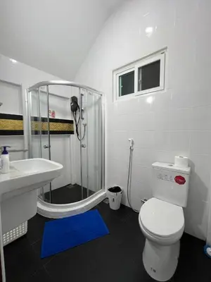 a bathroom with a shower and a toilet and a sink at Charming Villa Suite with Cozy Terrace near Beach in Patong Beach